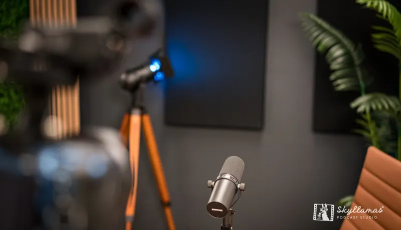 Broadcast microphone on a boom arm at the recording desk